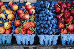 Colorful array of fresh fruits at farmer's market, bursting with flavors of the summer harvest photo