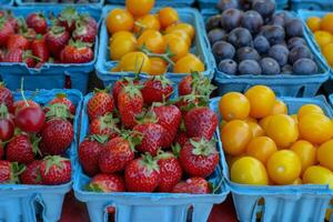 Colorful array of fresh fruits at farmer's market, bursting with flavors of the summer harvest photo