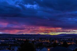 Sunset painting the sky with hues of orange, pink, and purple, signaling the end of summer day photo