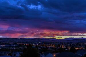 Sunset painting the sky with hues of orange, pink, and purple, signaling the end of summer day photo