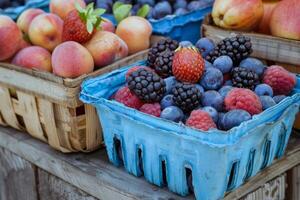 Colorful array of fresh fruits at farmer's market, bursting with flavors of the summer harvest photo