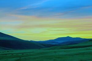 Sunset painting the sky with hues of orange, pink, and purple, signaling the end of summer day photo