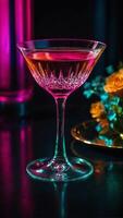 Glamourous cocktail sparkling with an alluring shade of pink in the glass photo