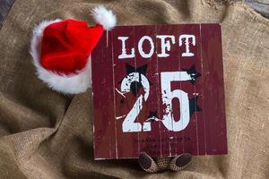 Santa cap on natural sackcloth background photo