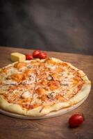 Pizza on the wooden table photo
