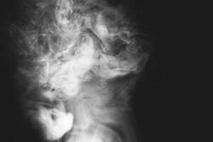 White smoke isolated on black background photo