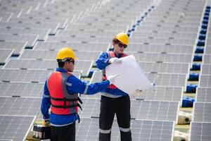 Photovoltaic engineers work on floating photovoltaics. Inspect and repair the solar panel equipment floating on the water. photo