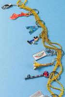 Souvenirs keychains from different cities of the world photo