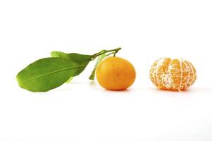Ripe tangerines on the white background photo