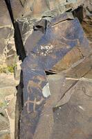 Petroglyphs within the Archaeological Landscape of Tamgaly. Almaty area, Kazakhstan photo