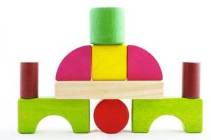 Wooden toy blocks on white background photo