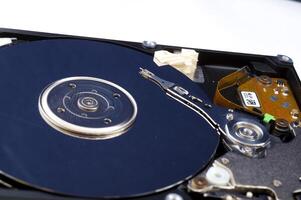 Close-up inside view of hard disk isolated on white background photo