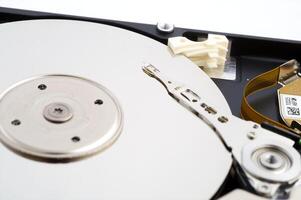 Close-up inside view of hard disk isolated on white background photo