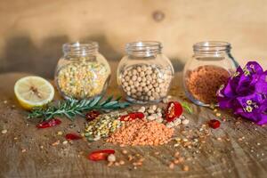 Raw cereals set on wooden background photo