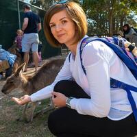 Beautiful girl with kangaroo in the national park, Brisbane, Australia photo