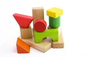 Wooden toy blocks on white background photo