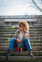 Fashion shot of a beautiful boho style girl on nature background. Boho, hippie photo