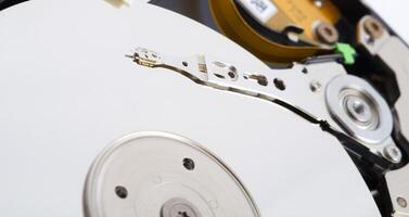 Close-up inside view of hard disk isolated on white background photo