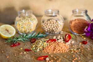 Raw cereals set on wooden background photo