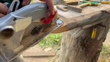 Worker sawing with a circular saw video