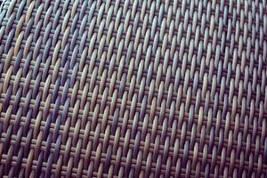 Synthetic rattan texture weaving background as used on outdoor garden furniture. photo