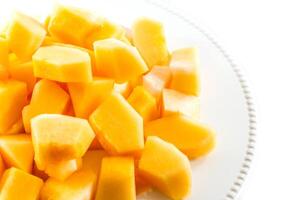 Sliced melon,cantaloupe in white disk on white background photo