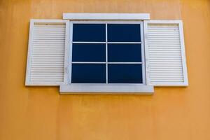 White windows and yellow color wall photo