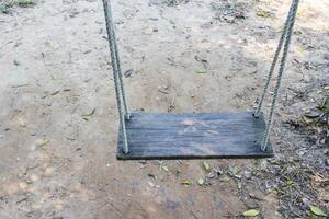 Old wooden tree swing photo