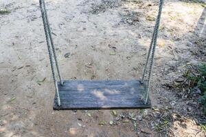 Old wooden tree swing photo