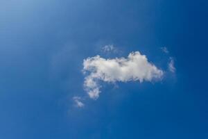 Cloud against the blue sky photo