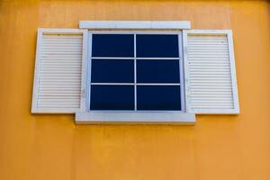 White windows and yellow color wall photo