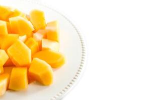 Sliced melon,cantaloupe in white disk on white background photo