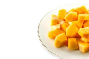 Sliced melon,cantaloupe in white disk on white background photo