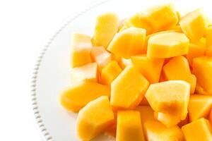 Sliced melon,cantaloupe in white disk on white background photo