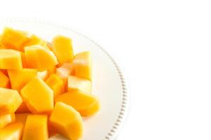 Sliced melon,cantaloupe in white disk on white background photo