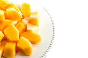 Sliced melon,cantaloupe in white disk on white background photo