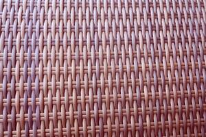 Synthetic rattan texture weaving background as used on outdoor garden furniture. photo