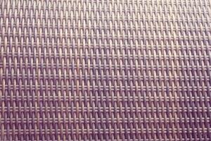 Synthetic rattan texture weaving background as used on outdoor garden furniture. photo