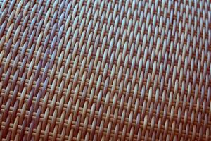 Synthetic rattan texture weaving background as used on outdoor garden furniture. photo