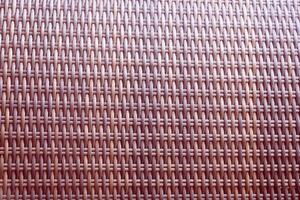 Synthetic rattan texture weaving background as used on outdoor garden furniture. photo