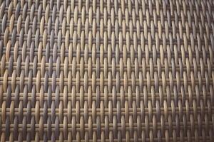 Synthetic rattan texture weaving background as used on outdoor photo