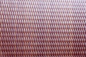 Synthetic rattan texture weaving background as used on outdoor garden furniture. photo