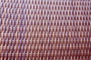 Synthetic rattan texture weaving background as used on outdoor garden furniture. photo