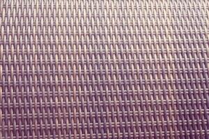 Synthetic rattan texture weaving background as used on outdoor garden furniture. photo