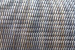 Synthetic rattan texture weaving background as used on outdoor garden furniture. photo