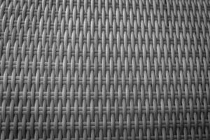 Synthetic rattan texture weaving background as used on outdoor photo