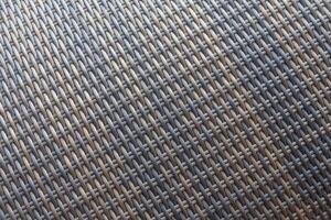 Synthetic rattan texture weaving background as used on outdoor garden furniture. photo