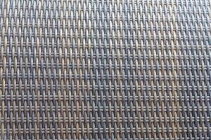 Synthetic rattan texture weaving background as used on outdoor garden furniture. photo