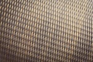 Synthetic rattan texture weaving background as used on outdoor garden furniture. photo