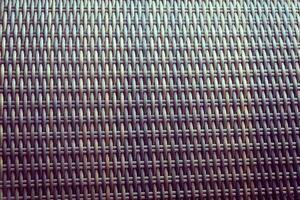 Synthetic rattan texture weaving background as used on outdoor garden furniture. photo